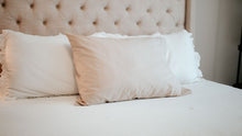 Load image into Gallery viewer, hoppy dreams pillow on a white bed
